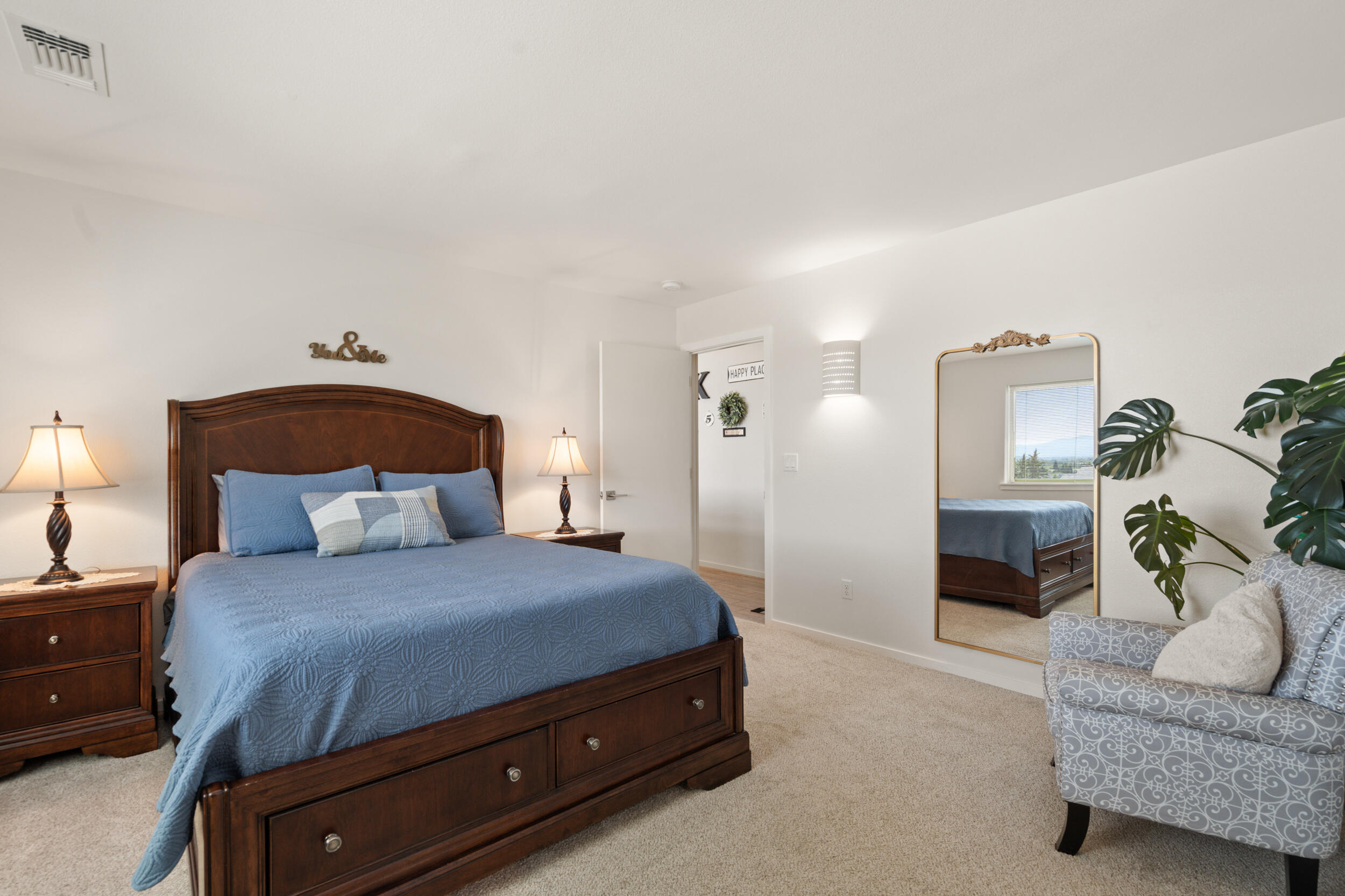 1008 Azure Way Eagle Point, OR 97524 - Photo 21 of 59 a bedroom with a bed and a couch
