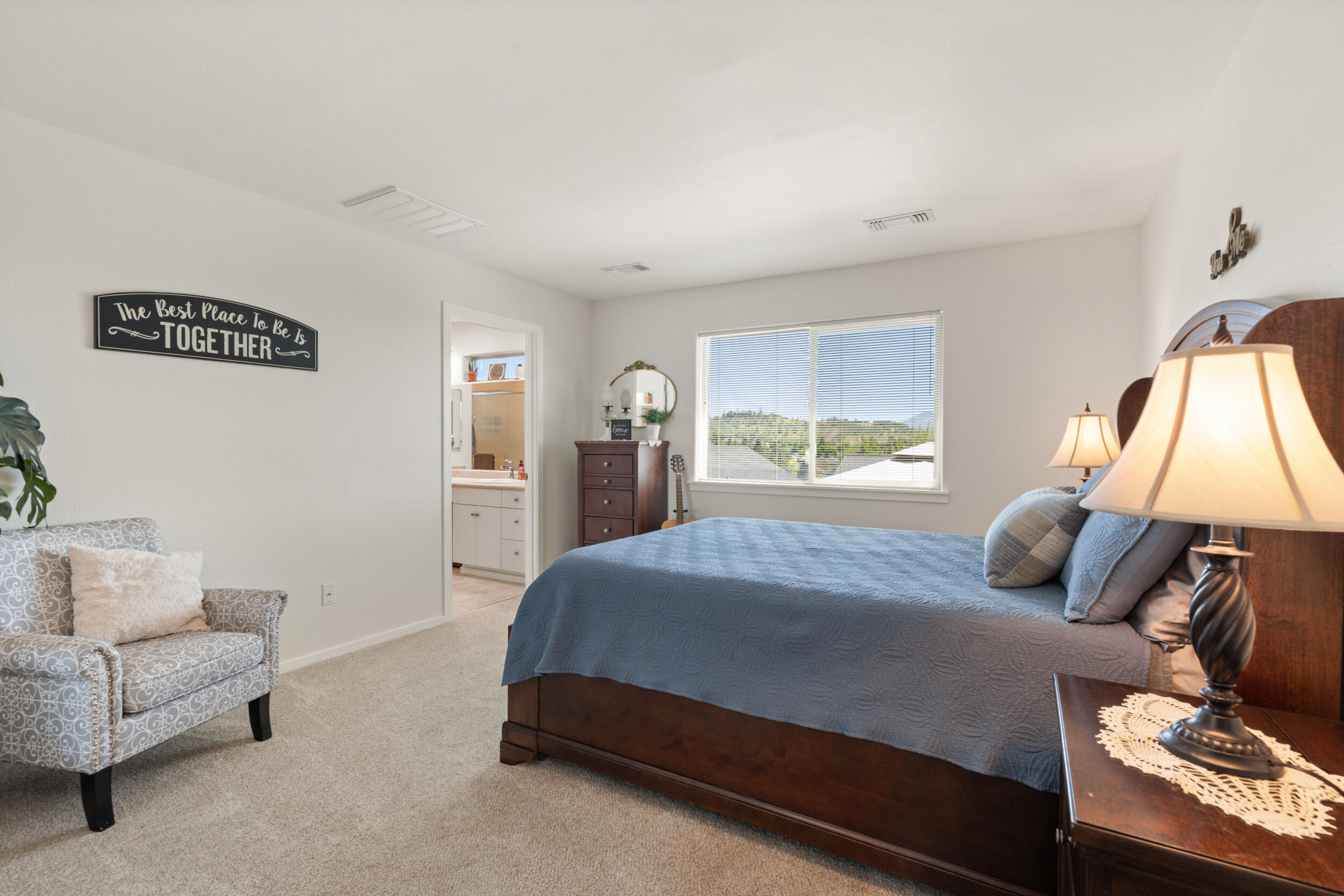 1008 Azure Way Eagle Point, OR 97524 - Photo 22 of 59 a bedroom with a bed and a couch