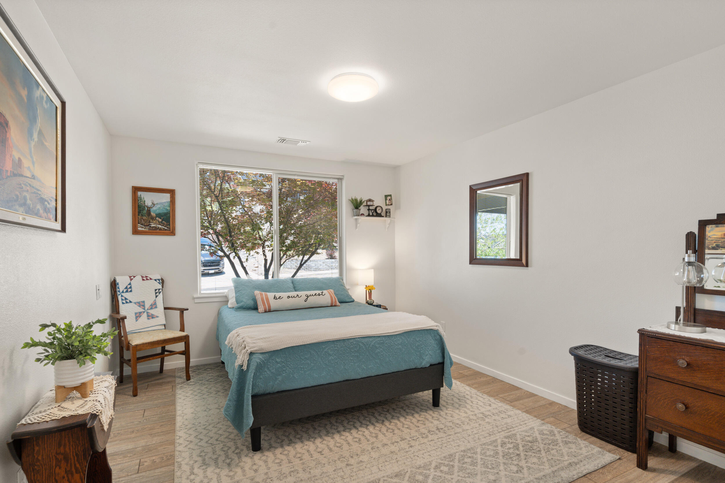 1008 Azure Way Eagle Point, OR 97524 - Photo 28 of 59 a bedroom with a large bed and a potted plant