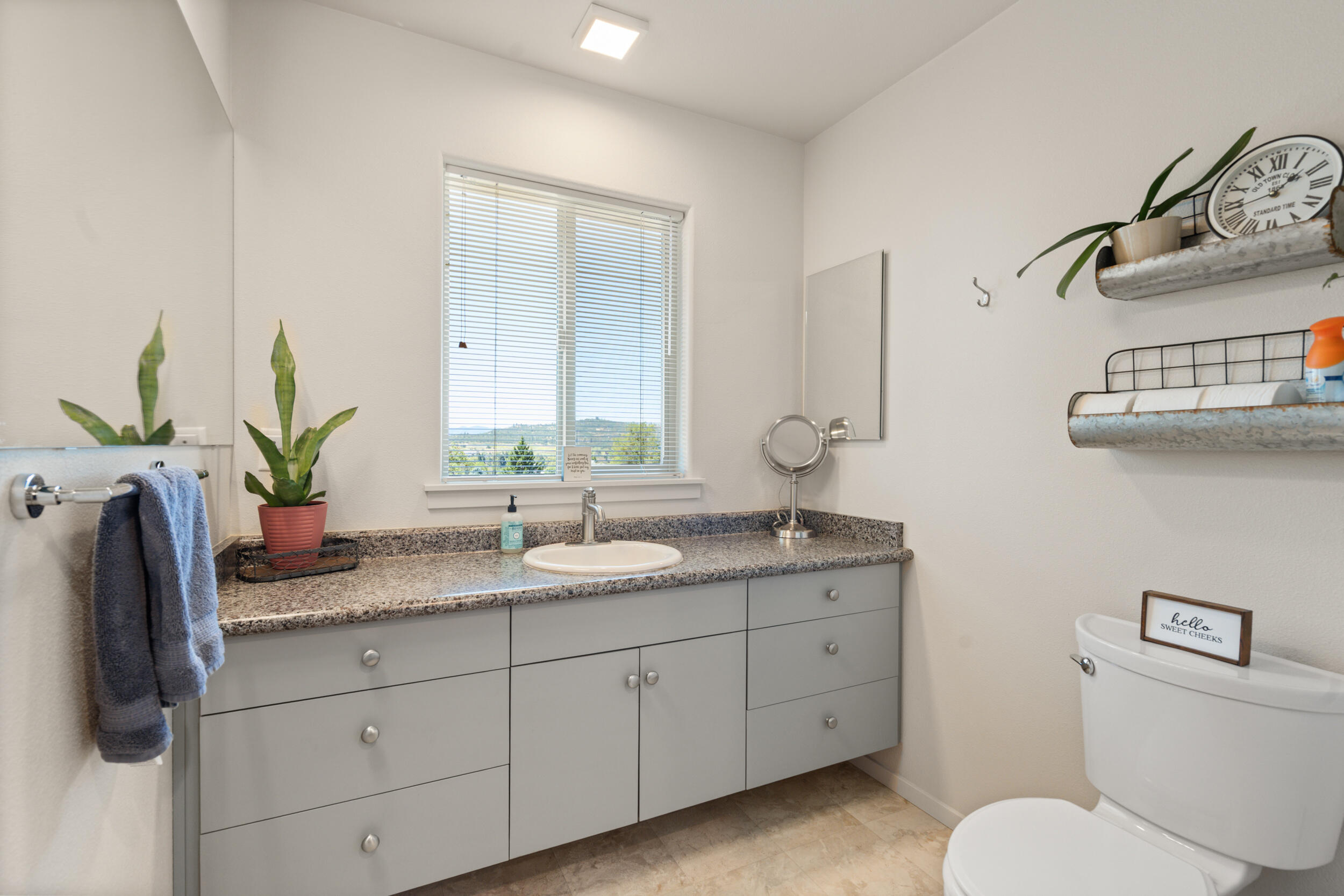 1008 Azure Way Eagle Point, OR 97524 - Photo 32 of 59 a bathroom with a granite countertop sink and a mirror