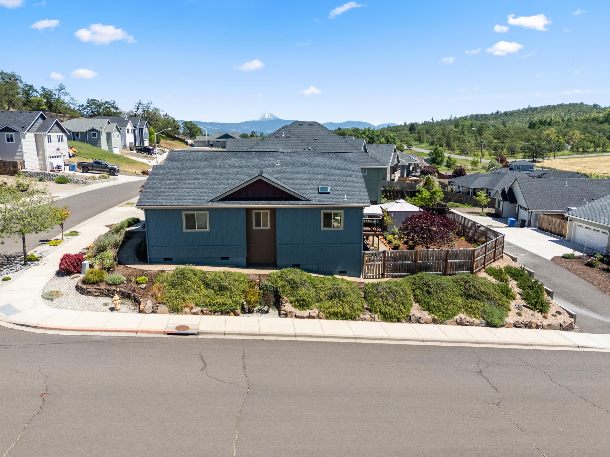 1008 Azure Way Eagle Point, OR 97524 - Photo 41 of 59 a front view of a house with a yard and garage
