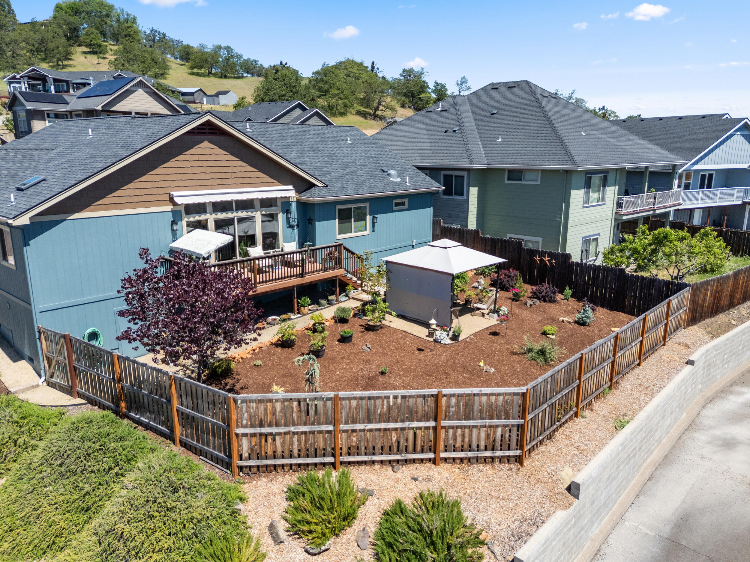 1008 Azure Way Eagle Point, OR 97524 - Photo 46 of 59 a aerial view of a house with large trees and plants
