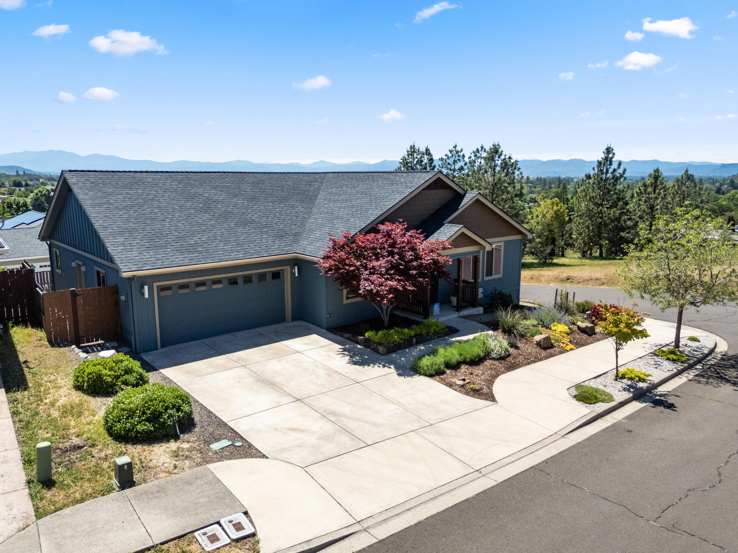 1008 Azure Way Eagle Point, OR 97524 - Photo 47 of 59 a front view of a house with a yard
