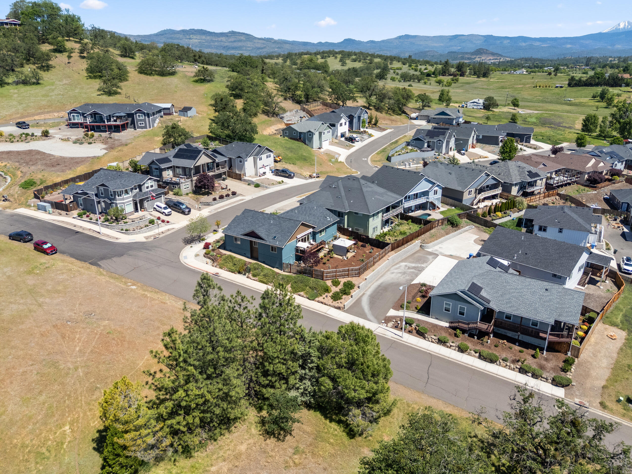 1008 Azure Way Eagle Point, OR 97524 - Photo 48 of 59 an aerial view of a city with lots of residential buildings and ocean view