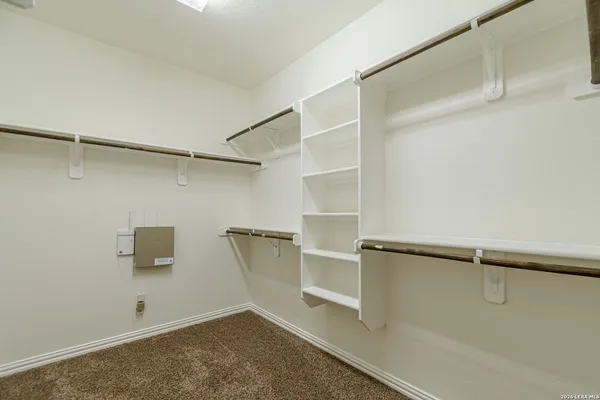 a view of a room with racks on the wall