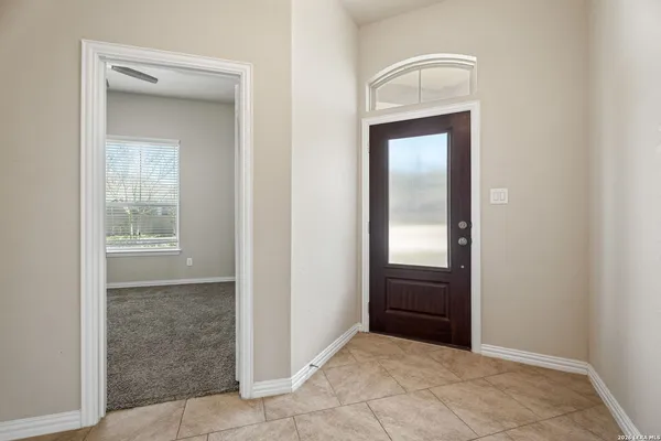 an empty room that has a wooden closet