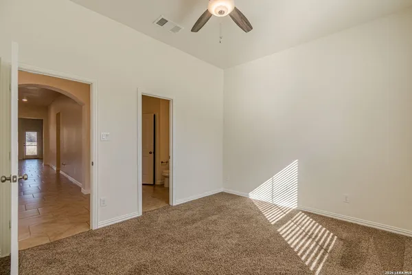 a view of hallway with wooden floor