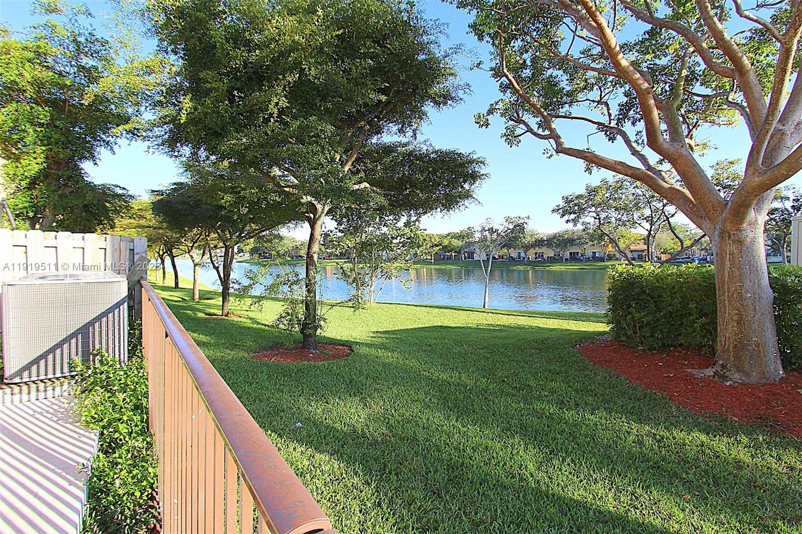 9390 Southwest 222nd Way, Unit 9390 Cutler Bay, FL 33190 - Photo 1 of 32 a view of a house with a backyard