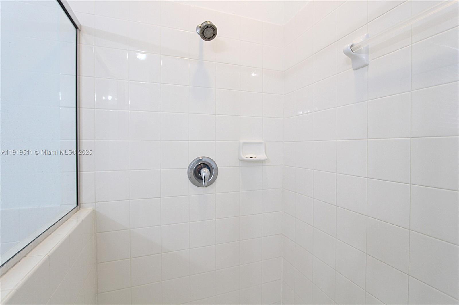 9390 Southwest 222nd Way, Unit 9390 Cutler Bay, FL 33190 - Photo 19 of 32 a bathroom with a shower
