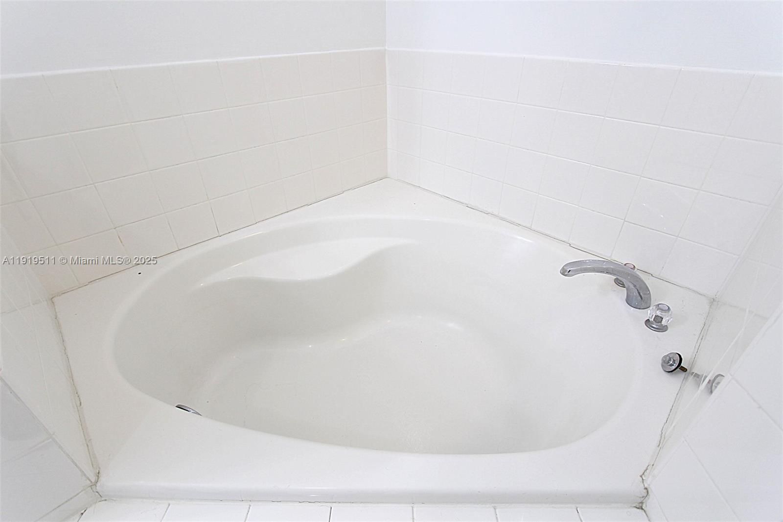 9390 Southwest 222nd Way, Unit 9390 Cutler Bay, FL 33190 - Photo 20 of 32 a close up of a bathtub