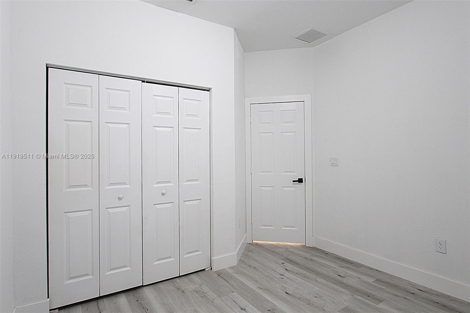 9390 Southwest 222nd Way, Unit 9390 Cutler Bay, FL 33190 - Photo 23 of 32 a view of an empty room