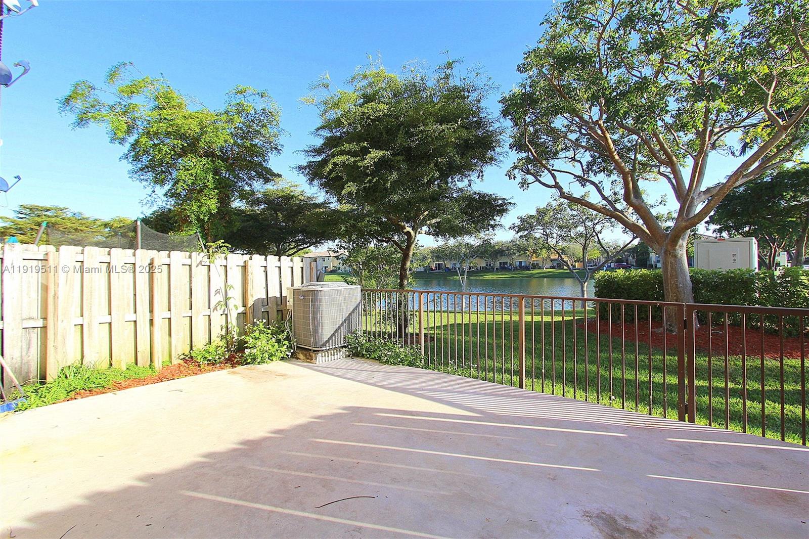 9390 Southwest 222nd Way, Unit 9390 Cutler Bay, FL 33190 - Photo 29 of 32 a view of a backyard with a garden