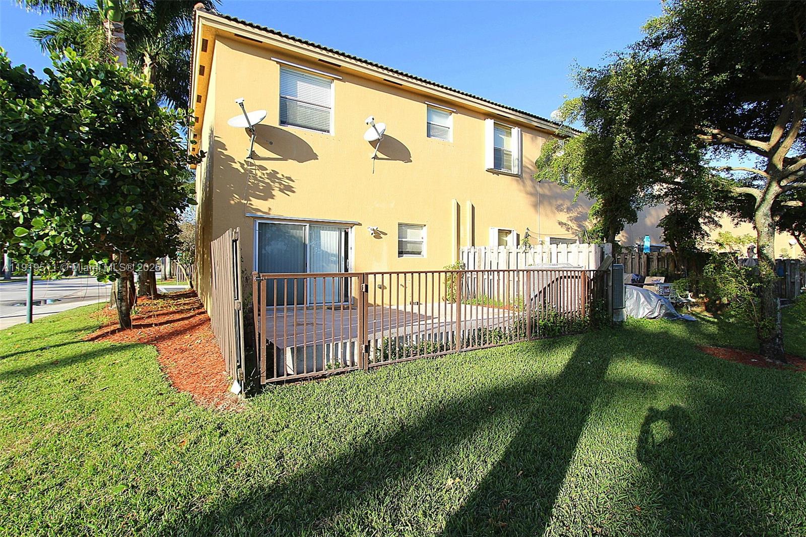 9390 Southwest 222nd Way, Unit 9390 Cutler Bay, FL 33190 - Photo 31 of 32 a view of a backyard with garden