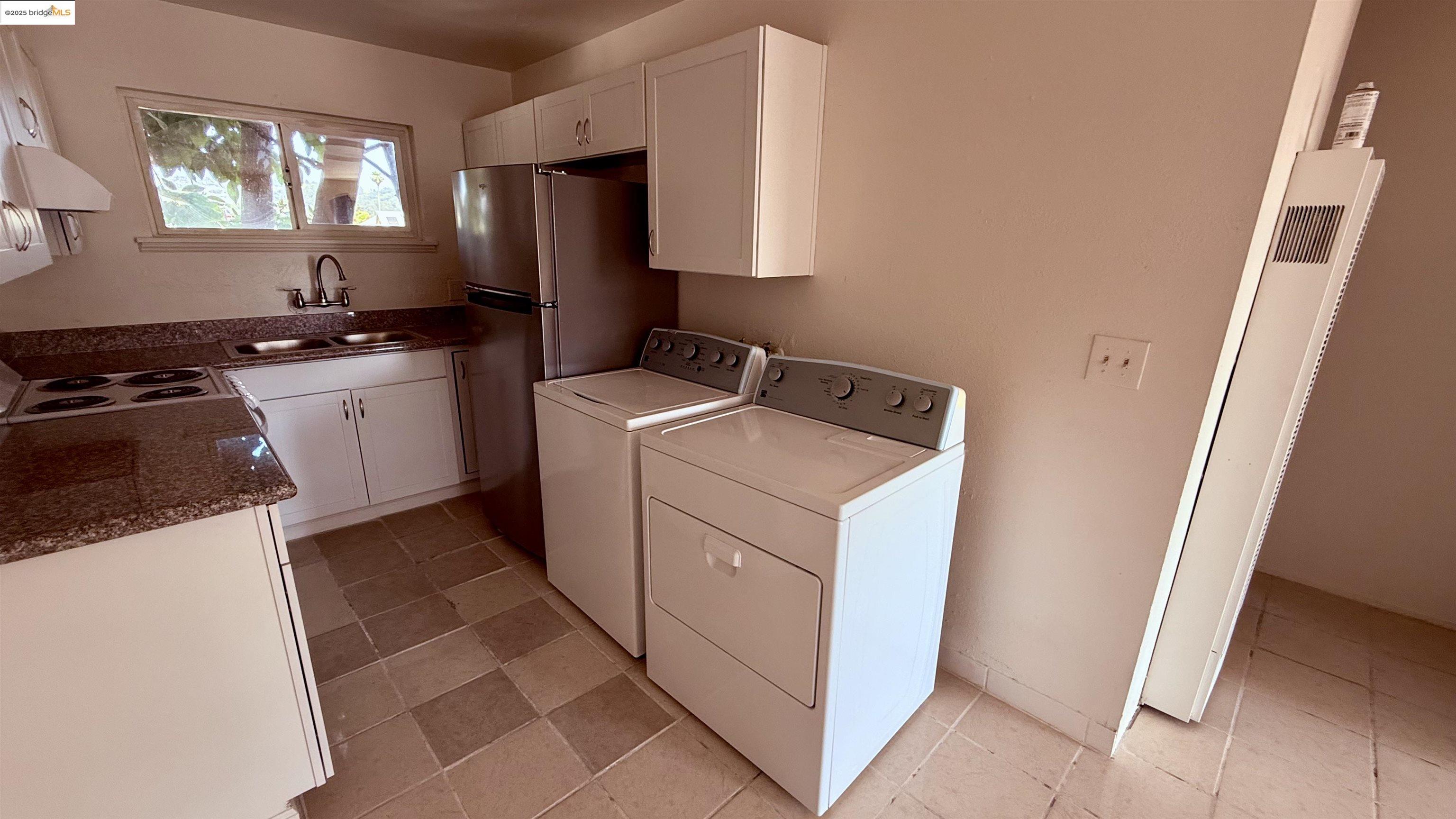 10100 Walnut Street, Unit 3 Oakland, CA 94603 - Photo 8 of 11 a kitchen with a cabinets and a stove top oven