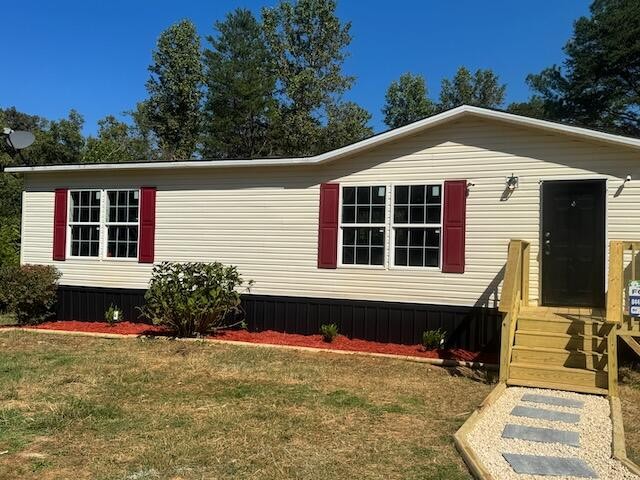 236 Wash Wilson Loop Blue Ridge, GA 30513 - Photo 19 of 22 a front view of a house with a yard