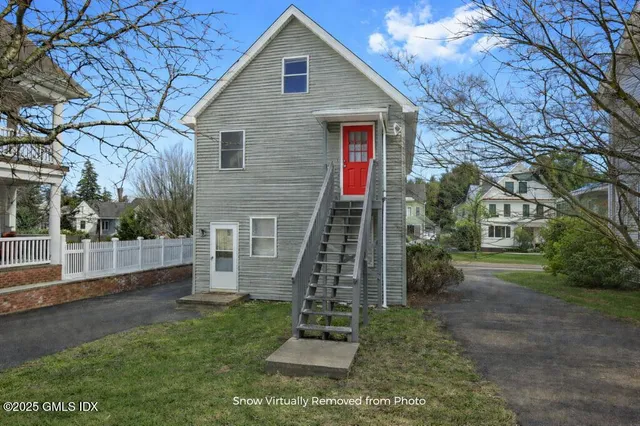 a view of a house with a yard