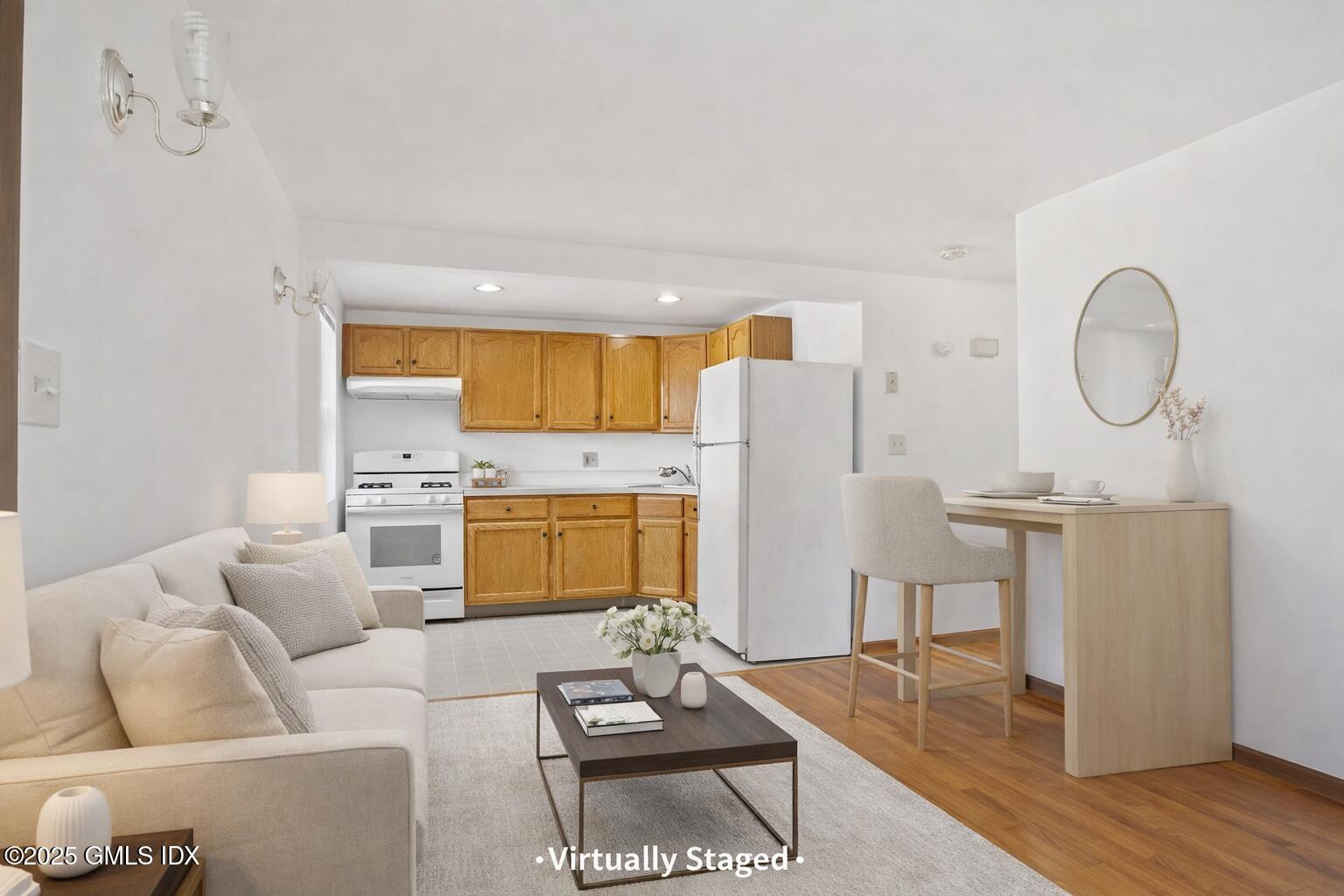 28 Orchard Place, Unit 2 Greenwich, CT 06830 - Photo 6 of 13 a living room with furniture and kitchen view