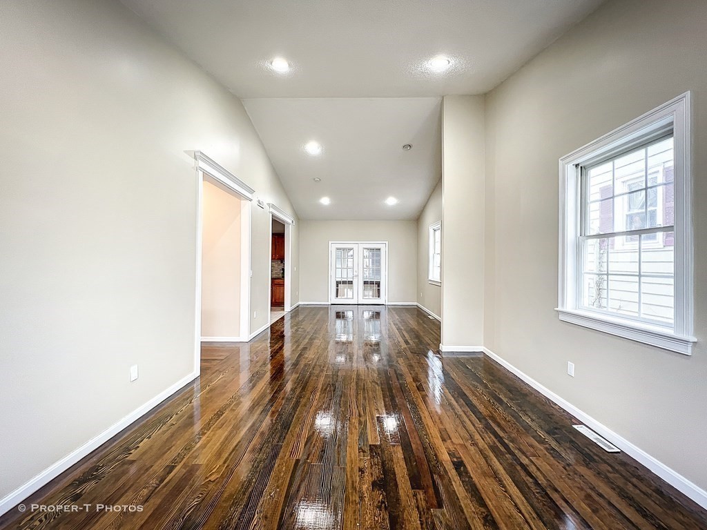 122 Osborne Terrace Springfield, MA 01104 - Photo 12 of 32 a view of empty room with wooden floor and windows