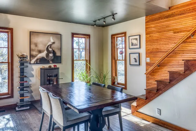 a view of a dining room with furniture window and wooden floor