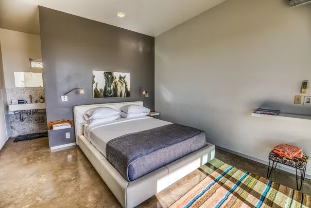 a bedroom with a bed and window