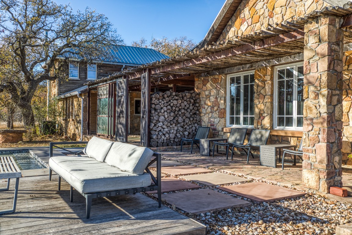 2969 County Road 422 Talpa, TX 76882 - Photo 34 of 40 a view of a patio with a table and chairs under an umbrella