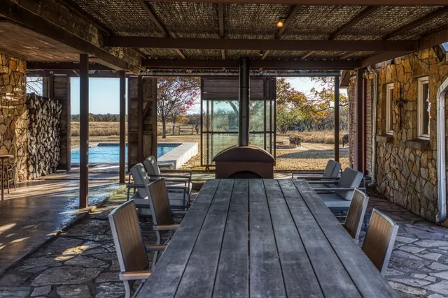 a view of a patio with swimming pool