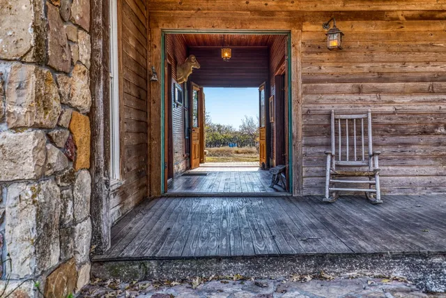 a view of front door of house with stairs