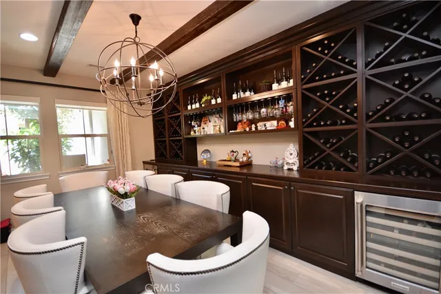 a kitchen with a table chairs stove and cabinets