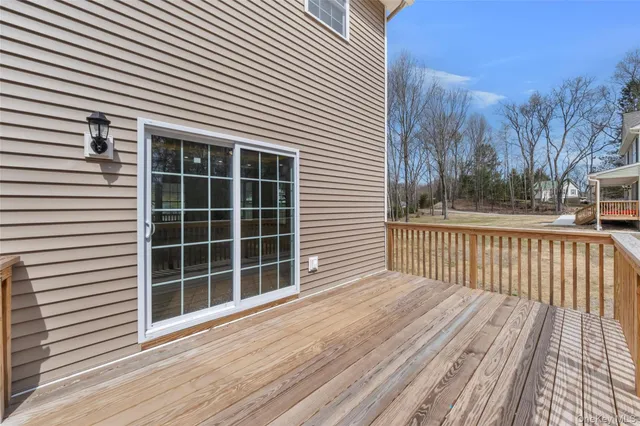 a view of a chair and tables in the balcony