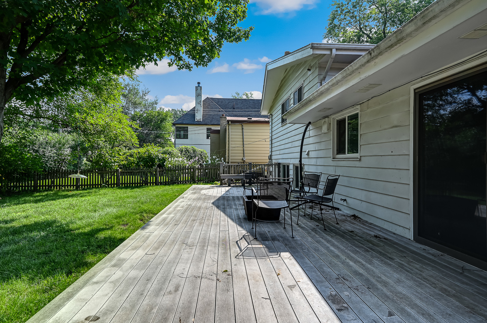 440 East Naperville Road Clarendon Hills, IL 60514 - Photo 19 of 23 a view of a house with backyard sitting area and garden