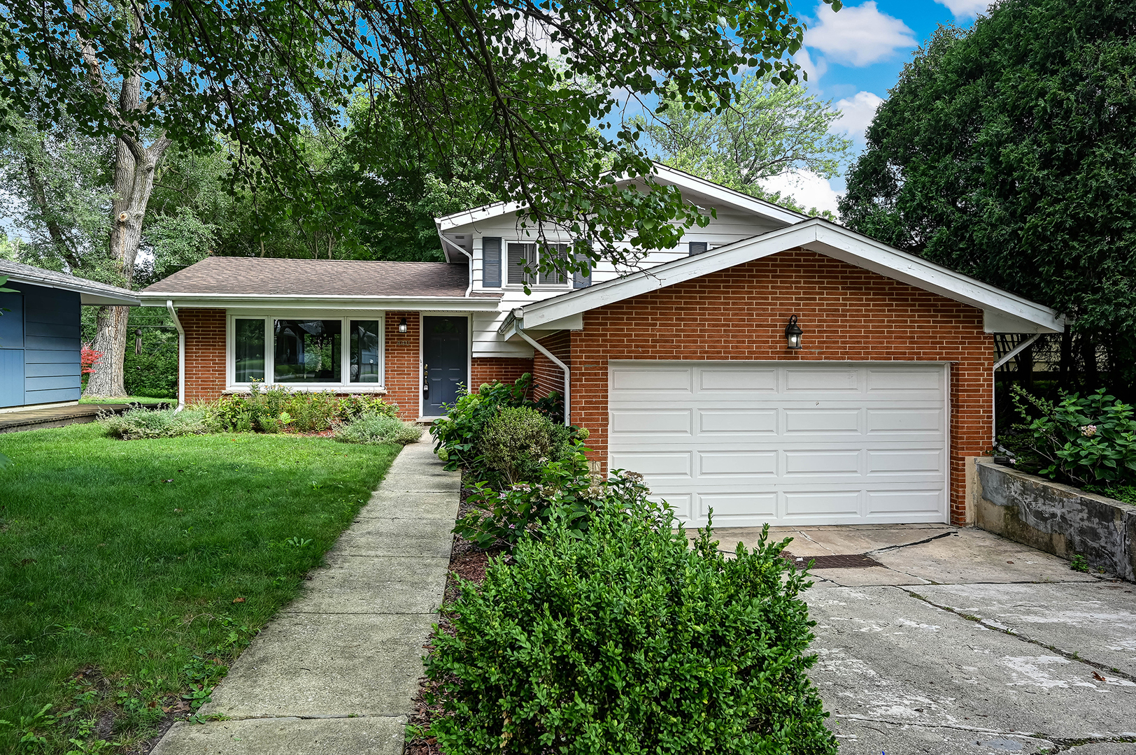 440 East Naperville Road Clarendon Hills, IL 60514 - Photo 2 of 23 a front view of a house with a yard and green space