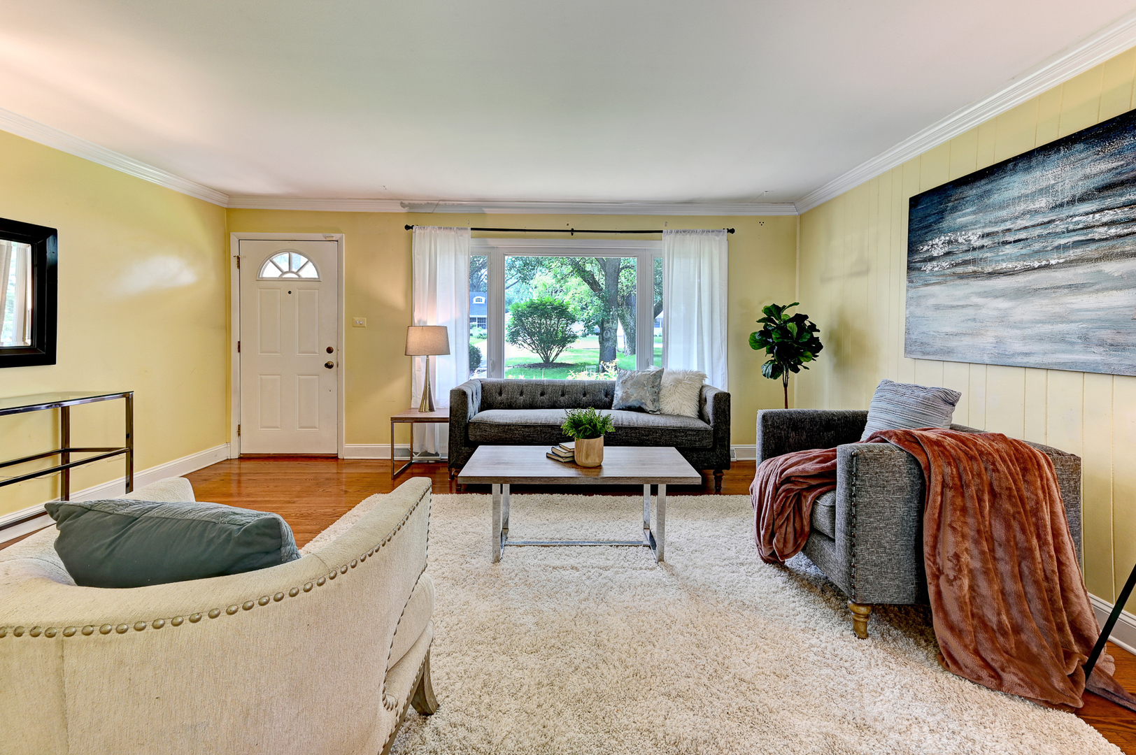 440 East Naperville Road Clarendon Hills, IL 60514 - Photo 3 of 23 a living room with furniture and a large window