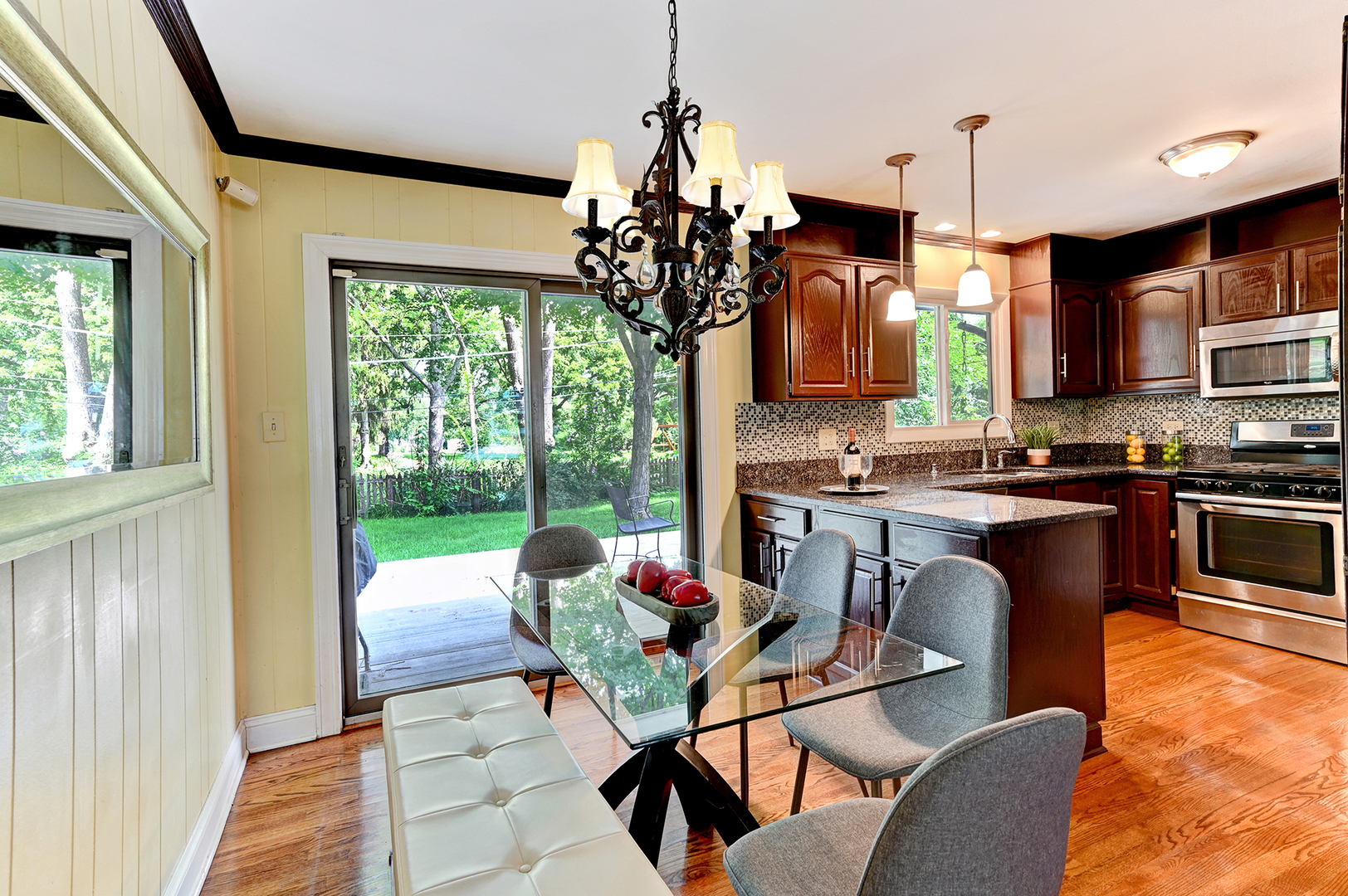 440 East Naperville Road Clarendon Hills, IL 60514 - Photo 7 of 23 a dining room with furniture a chandelier and window