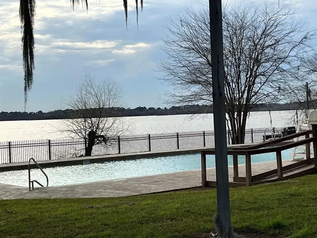 a view of a lake with a big yard