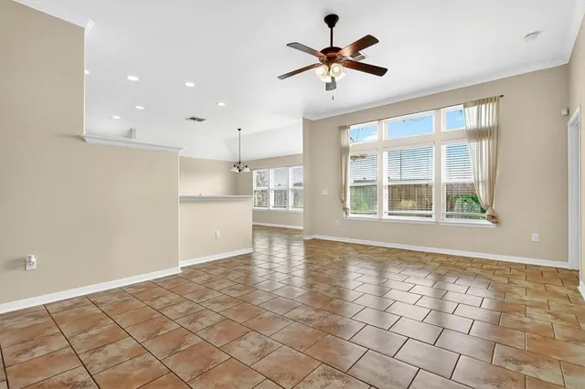 a view of a kitchen with a sink and a refrigerator