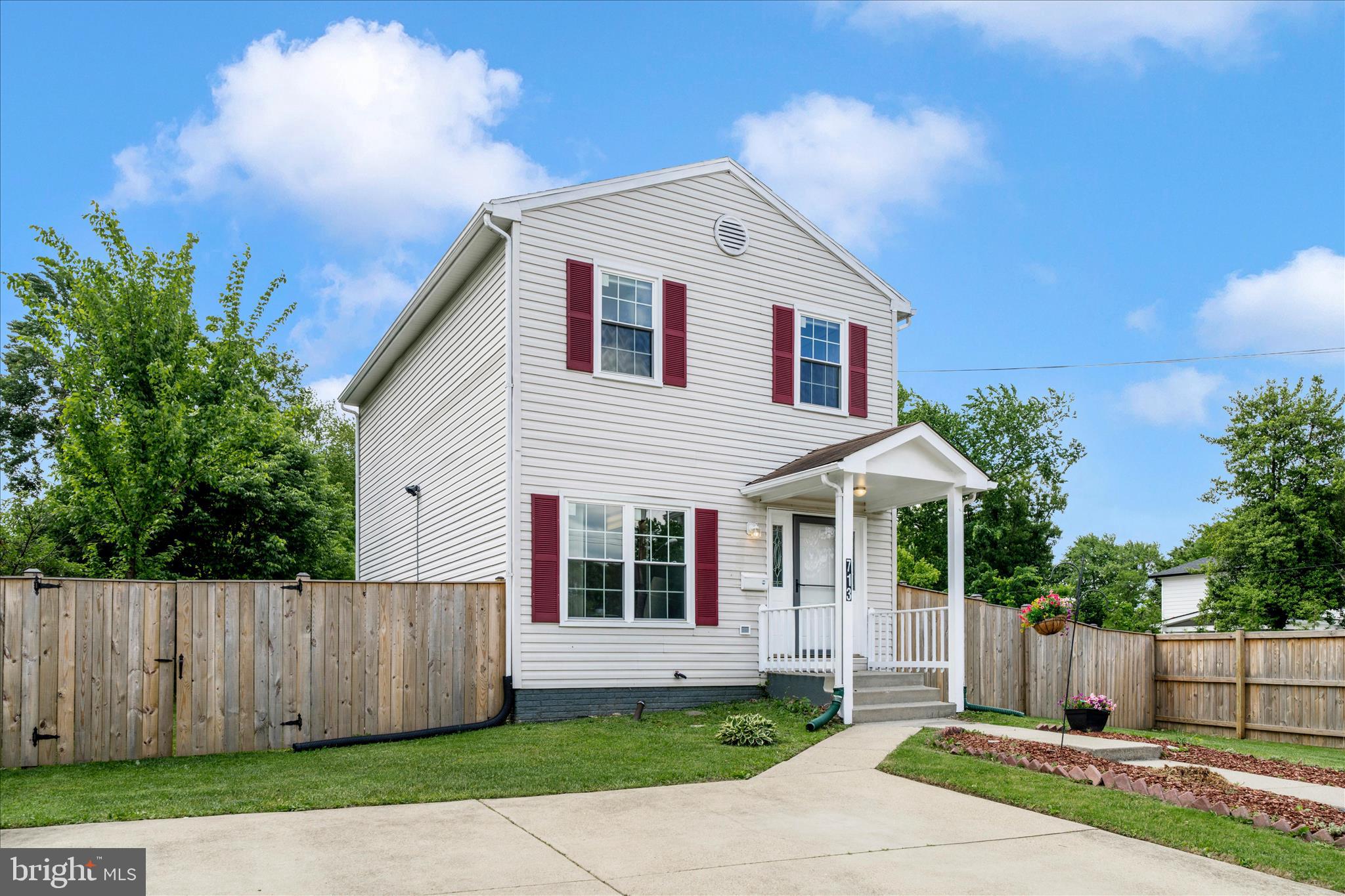 713 Seek Lane Silver Spring, MD 20912 - Photo 54 of 60 a front view of a house with a yard