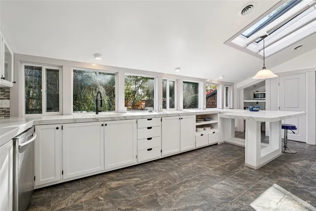 a large white room with cabinets