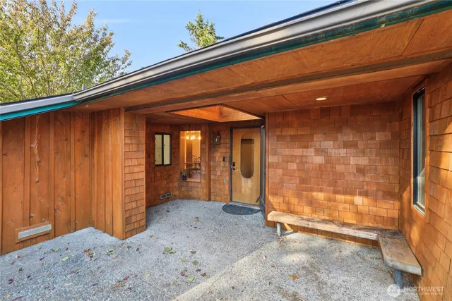 a view of a room with wooden floor and chair