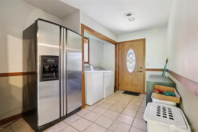 a kitchen with a refrigerator a stove top oven and a refrigerator