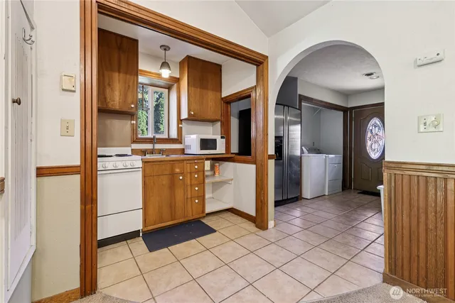 a kitchen with a cabinets and appliances