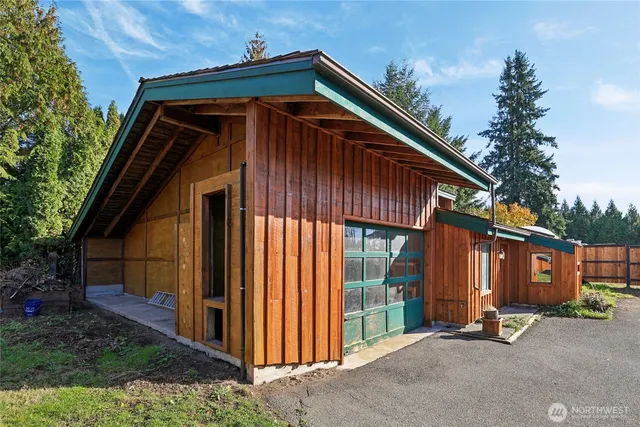 a front view of a house with garage