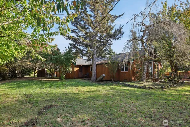 a view of a tree in front of a house