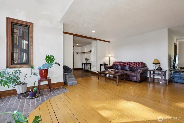 a living room with furniture and a table