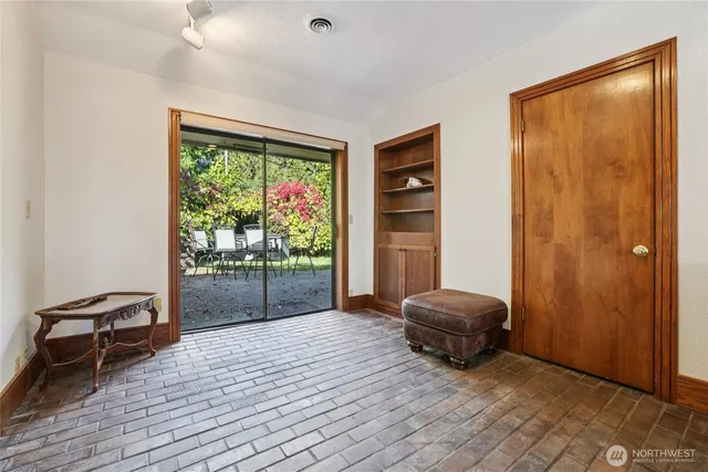 a living room with furniture and a gate
