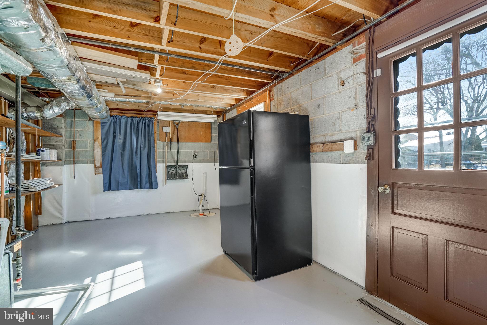 5701 Ashfield Road Alexandria, VA 22315 - Photo 41 of 51 Utility/ Laundry room with second Fridge