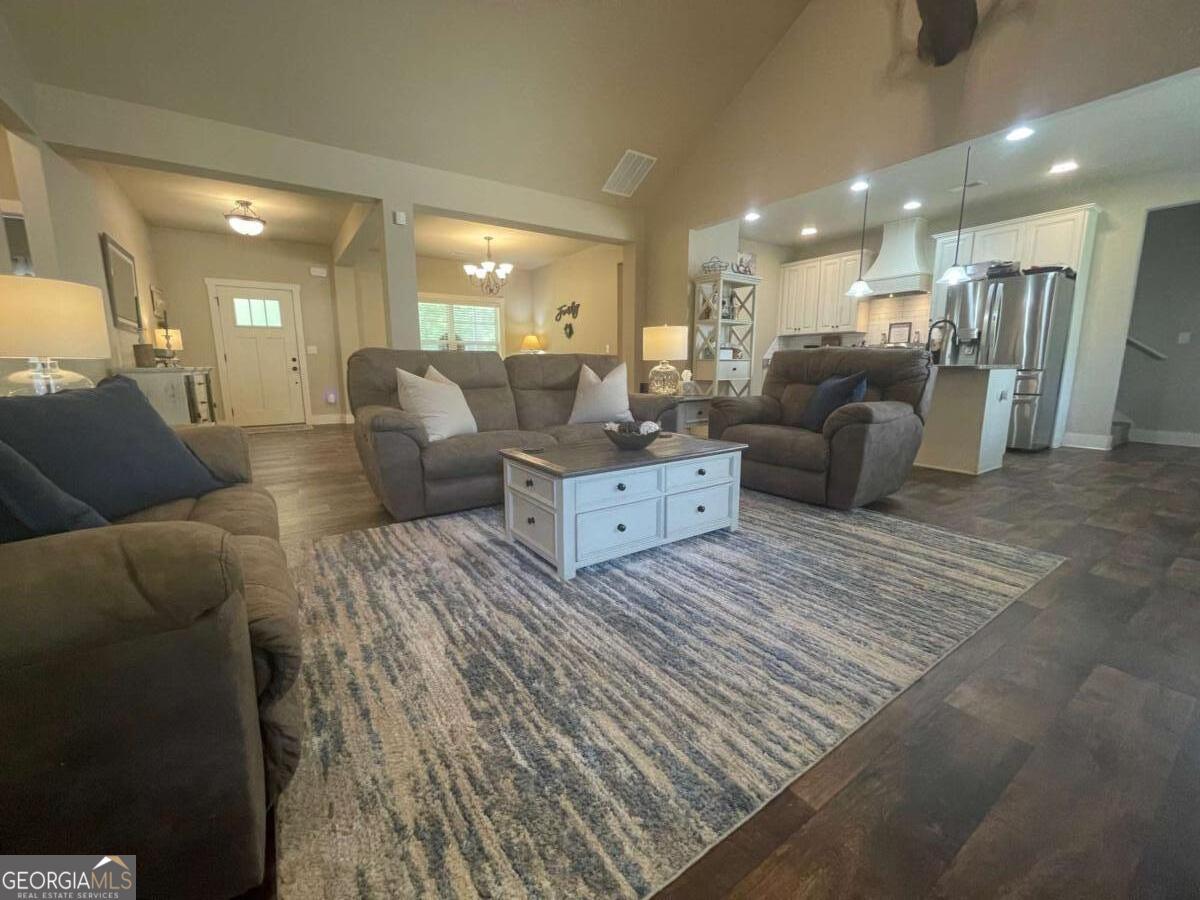 457 Old Good Hope Road Good Hope, GA 30641 - Photo 21 of 59 a living room with furniture and a large mirror with wooden floor