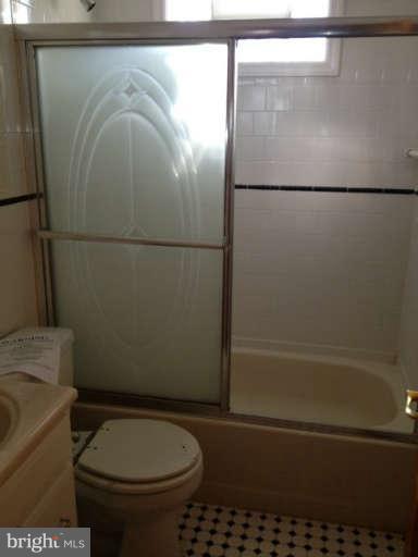 106 Riverthorn Road Baltimore, MD 21220 - Photo 14 of 18 a bathroom with a toilet and a shower