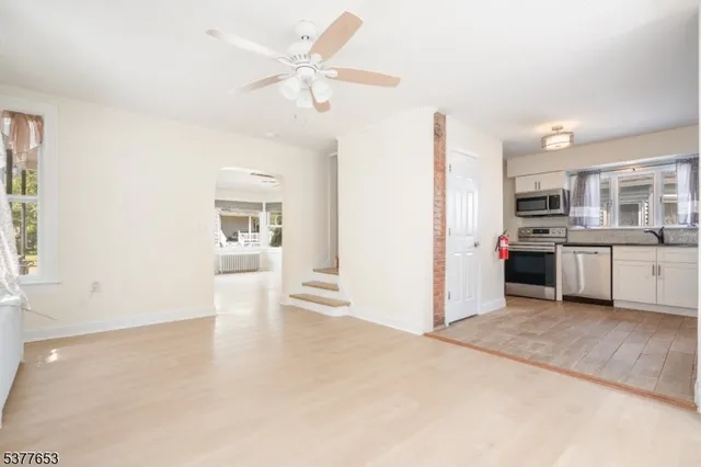 a view of a kitchen with a sink cabinets and a window