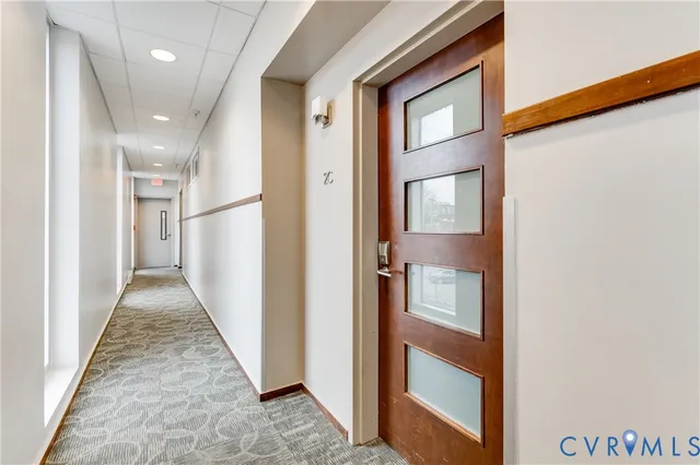 a living room with lots of furniture and clutter