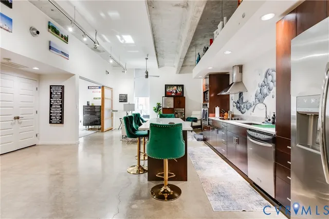a kitchen with furniture and a table